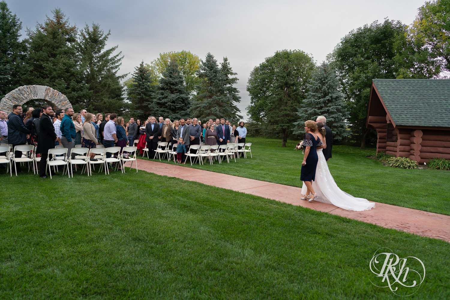 Wedding ceremony on rainy day at Glenhaven Events in Farmington, Minnesota.