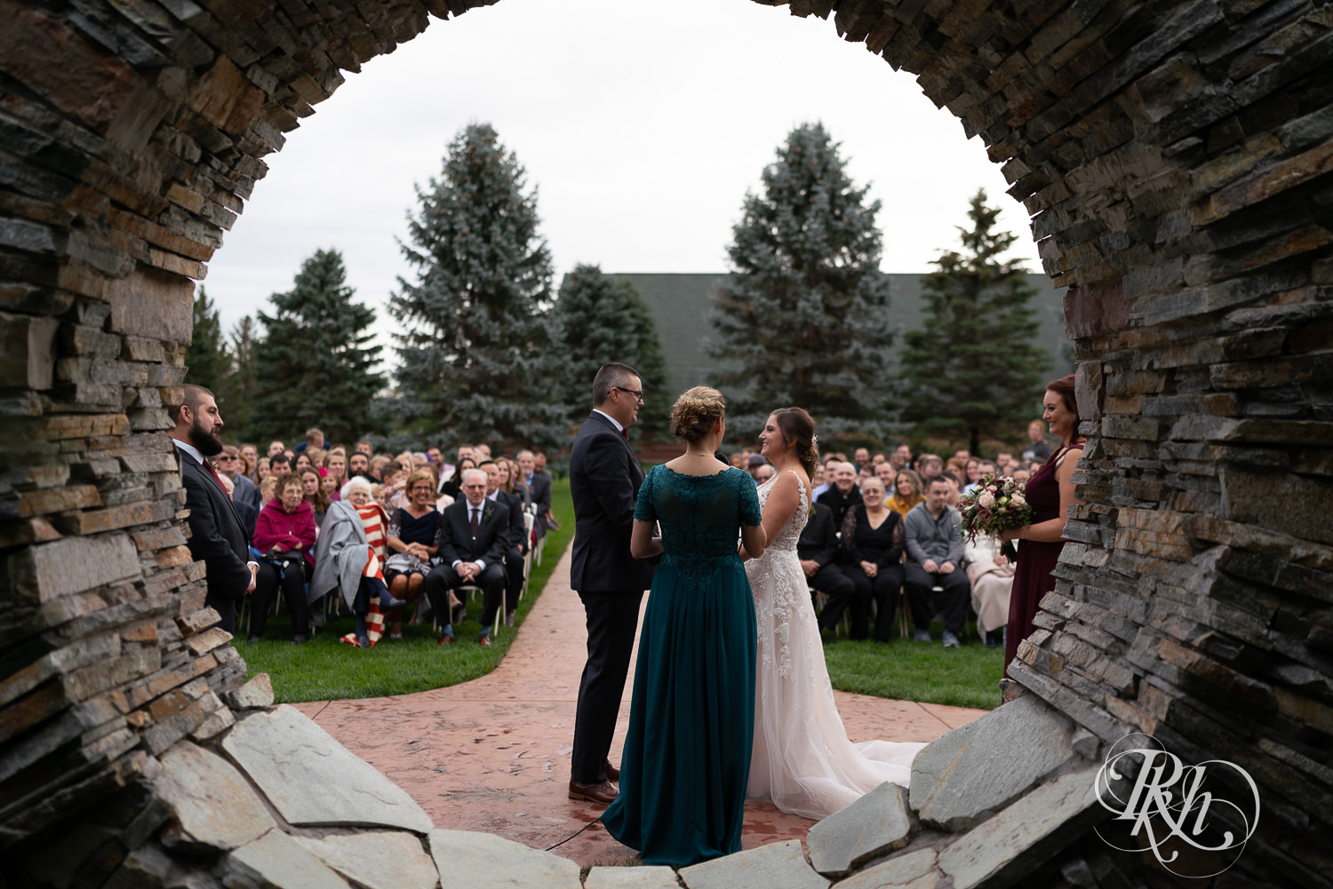 Wedding ceremony on rainy day at Glenhaven Events in Farmington, Minnesota.