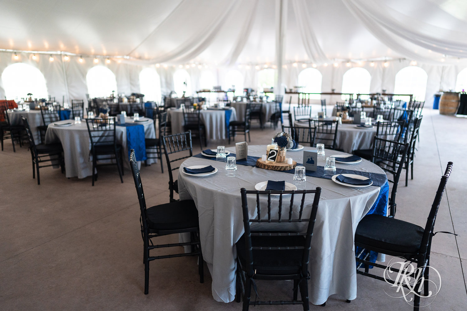 Tented reception setup at Stone Lion Winery and Events in Isanti, Minnesota. 