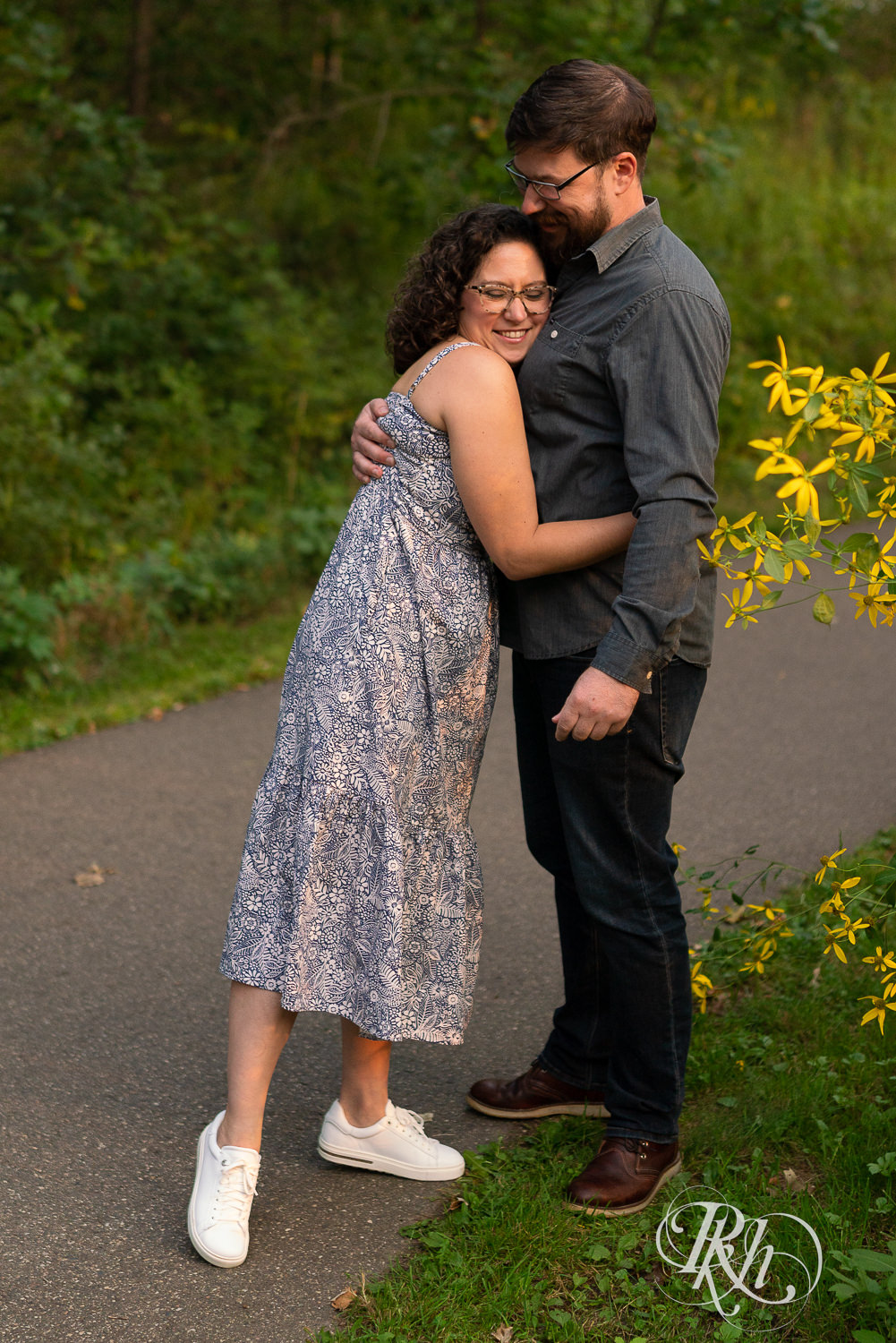 Man and woman hugging at sunset engagement session in Eagan, Minnesota.