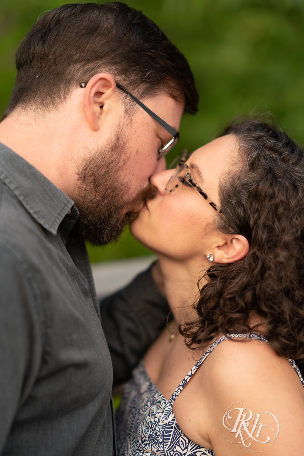 Man and woman kissing at sunset engagement session in Eagan, Minnesota.