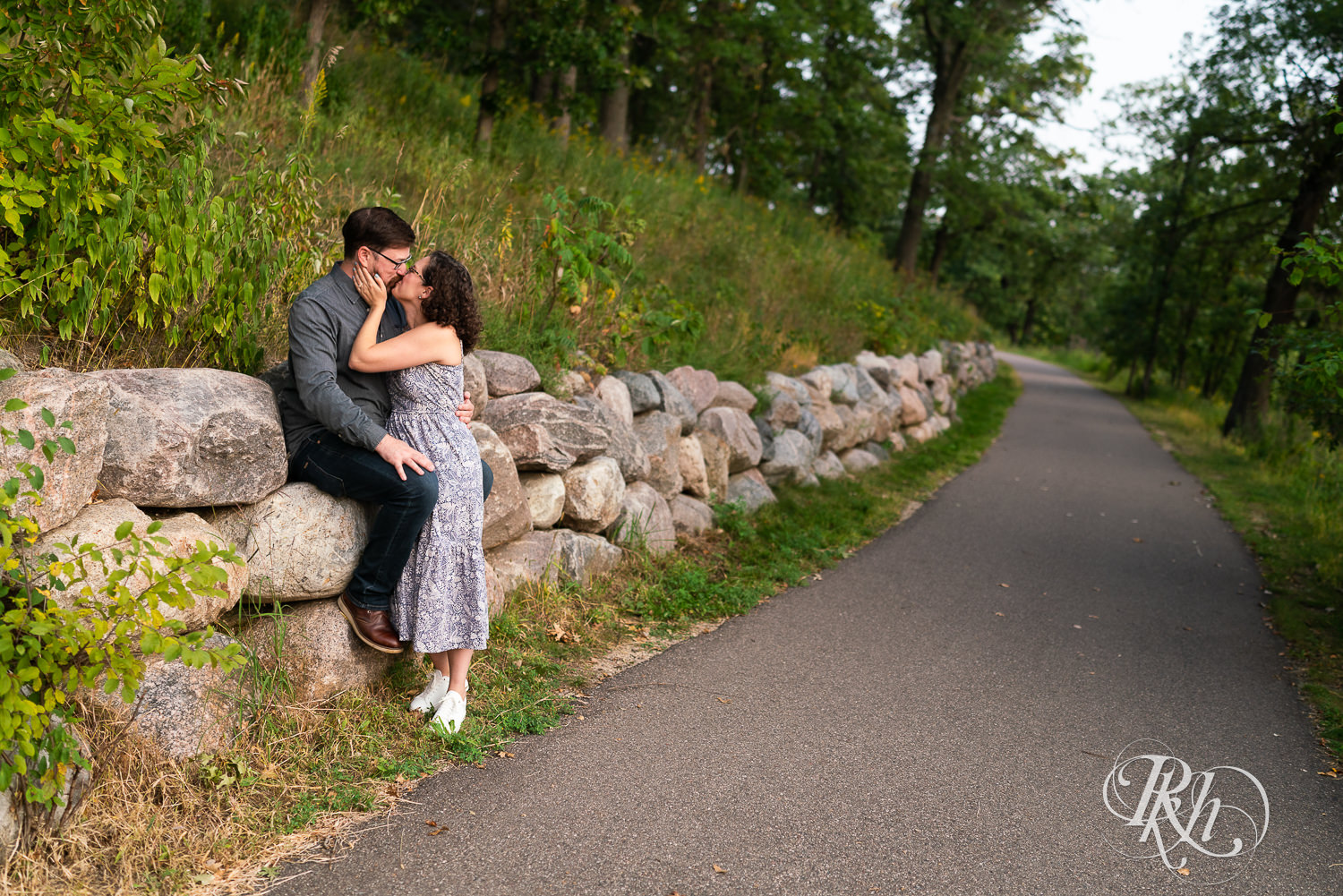Man and woman hugging at sunset engagement session in Eagan, Minnesota.