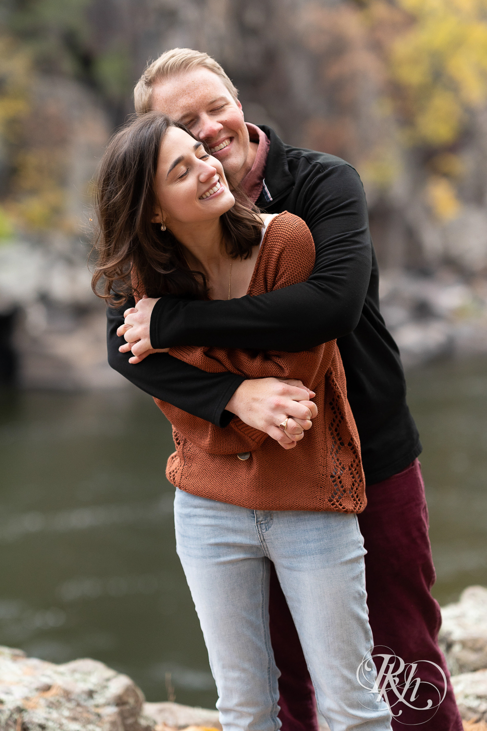 Annalyse and Brent snuggling at their sunrise engagement session in Taylors Falls, Minnesota.