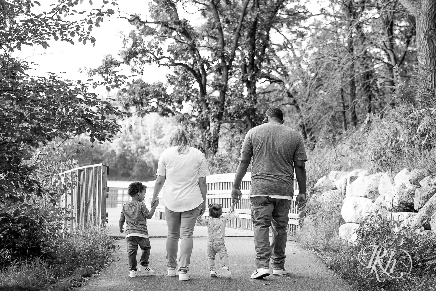 Mom and dad walking with their two children.