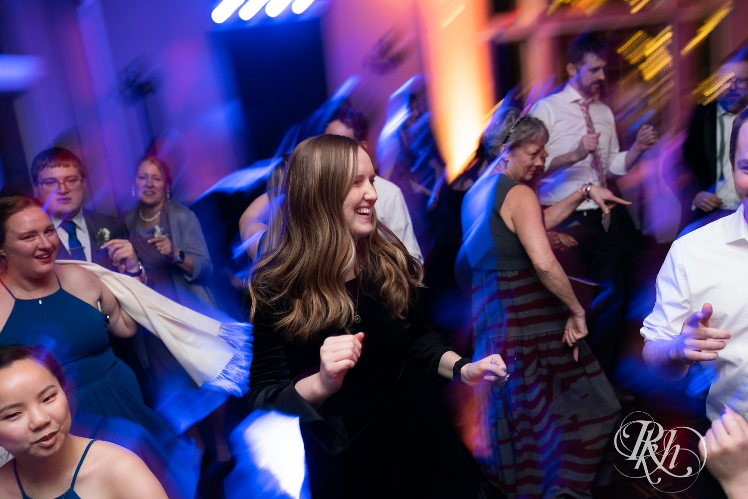 Guests dance at wedding reception at Minneapolis Golf Club in Saint Louis Park, Minnesota.