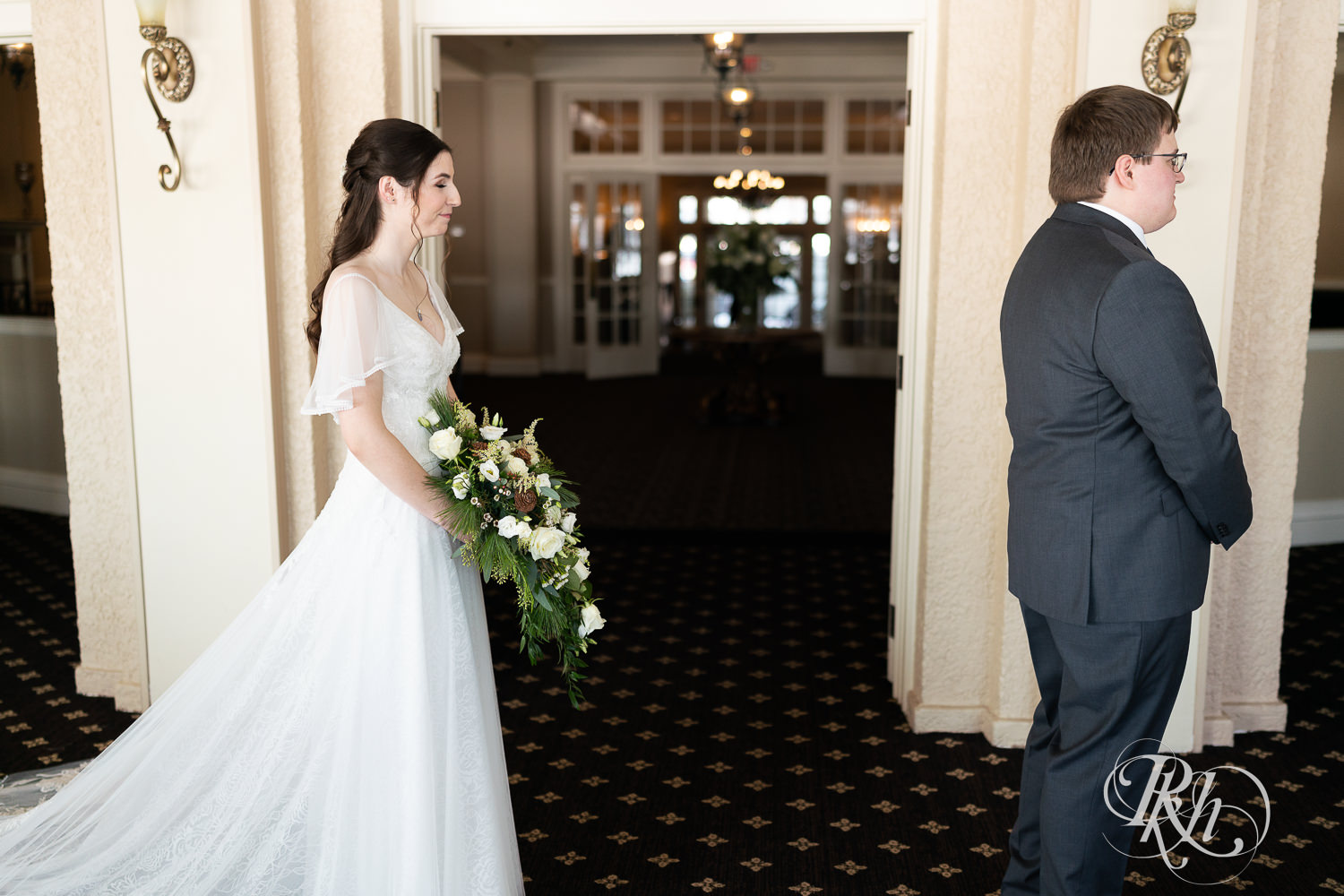 First look between bride and groom at Minneapolis Golf Club in Saint Louis Park, Minnesota.