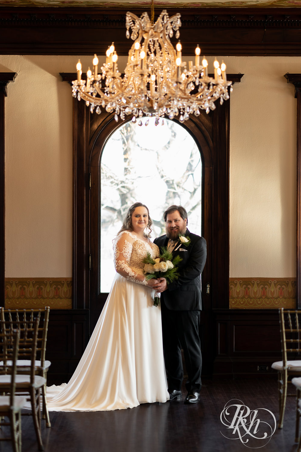 Bride and groom smiling at Semple Mansion in Minneapolis, Minnesota.