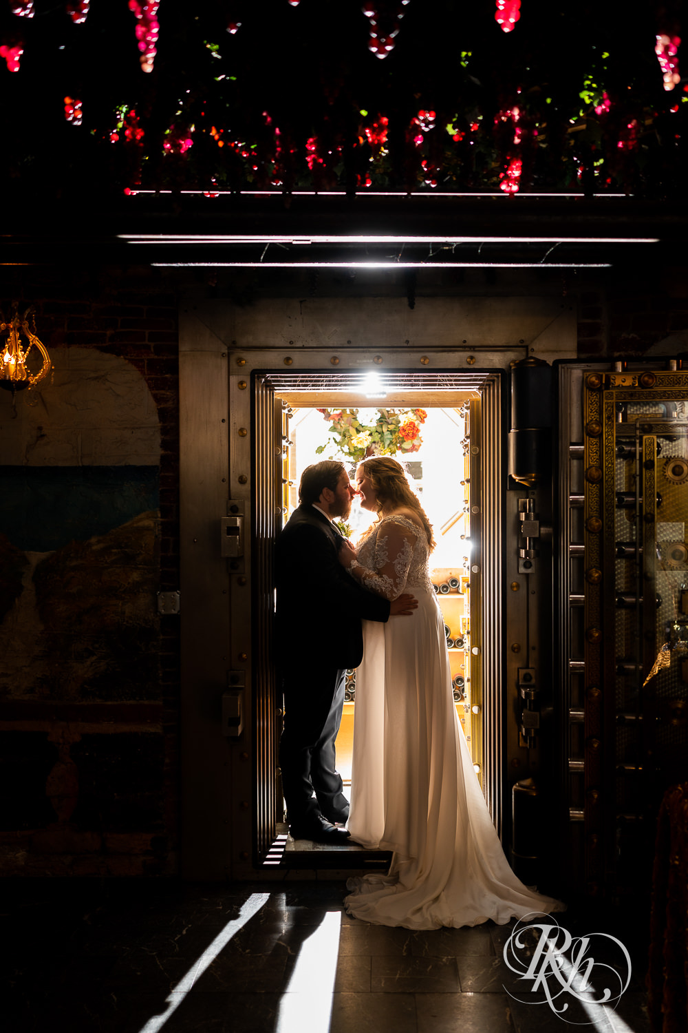Bride and groom kissing in wine grotto at Semple Mansion in Minneapolis, Minnesota.