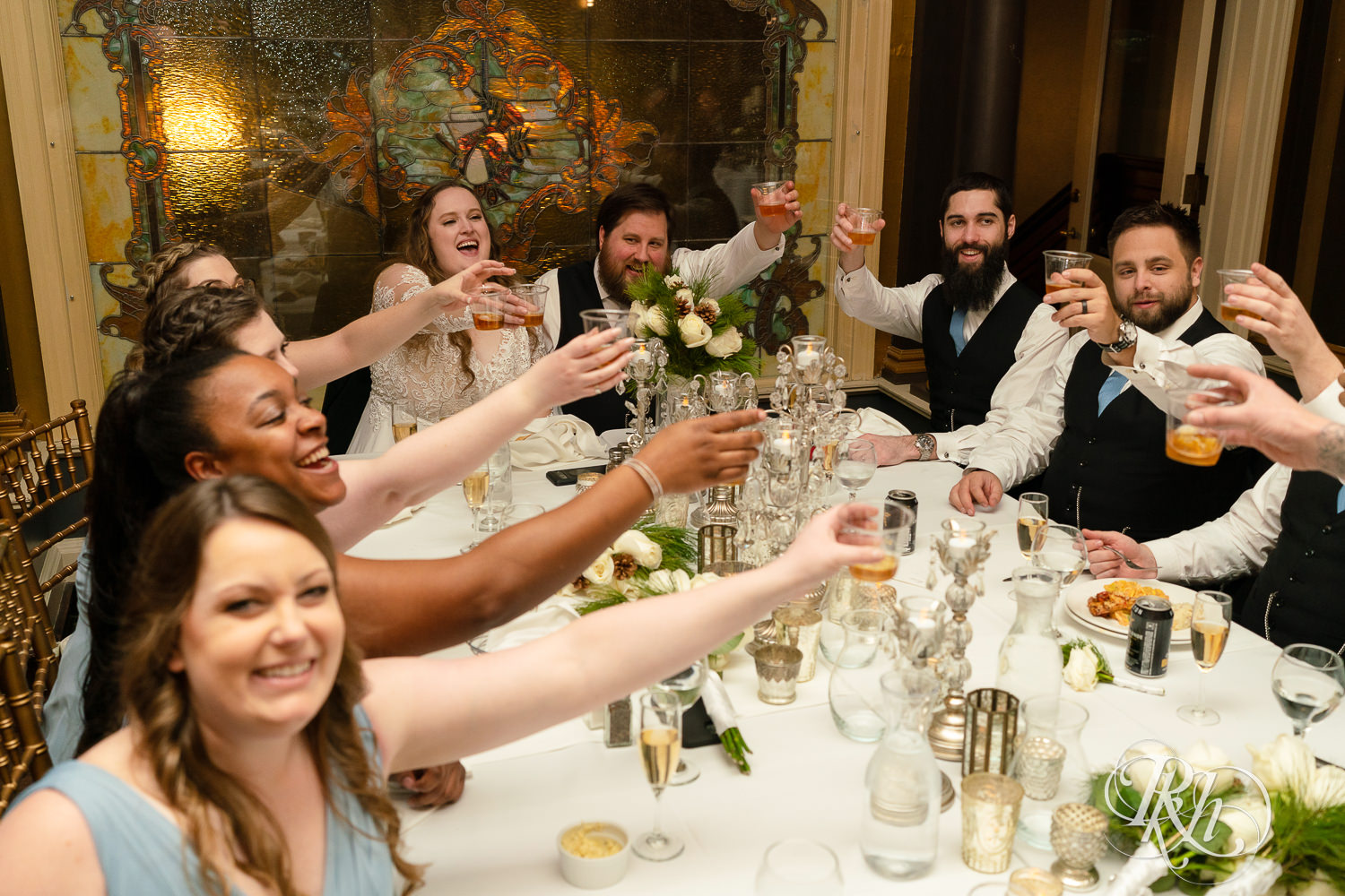Wedding party toasts during speeches at Semple Mansion in Minneapolis, Minnesota.