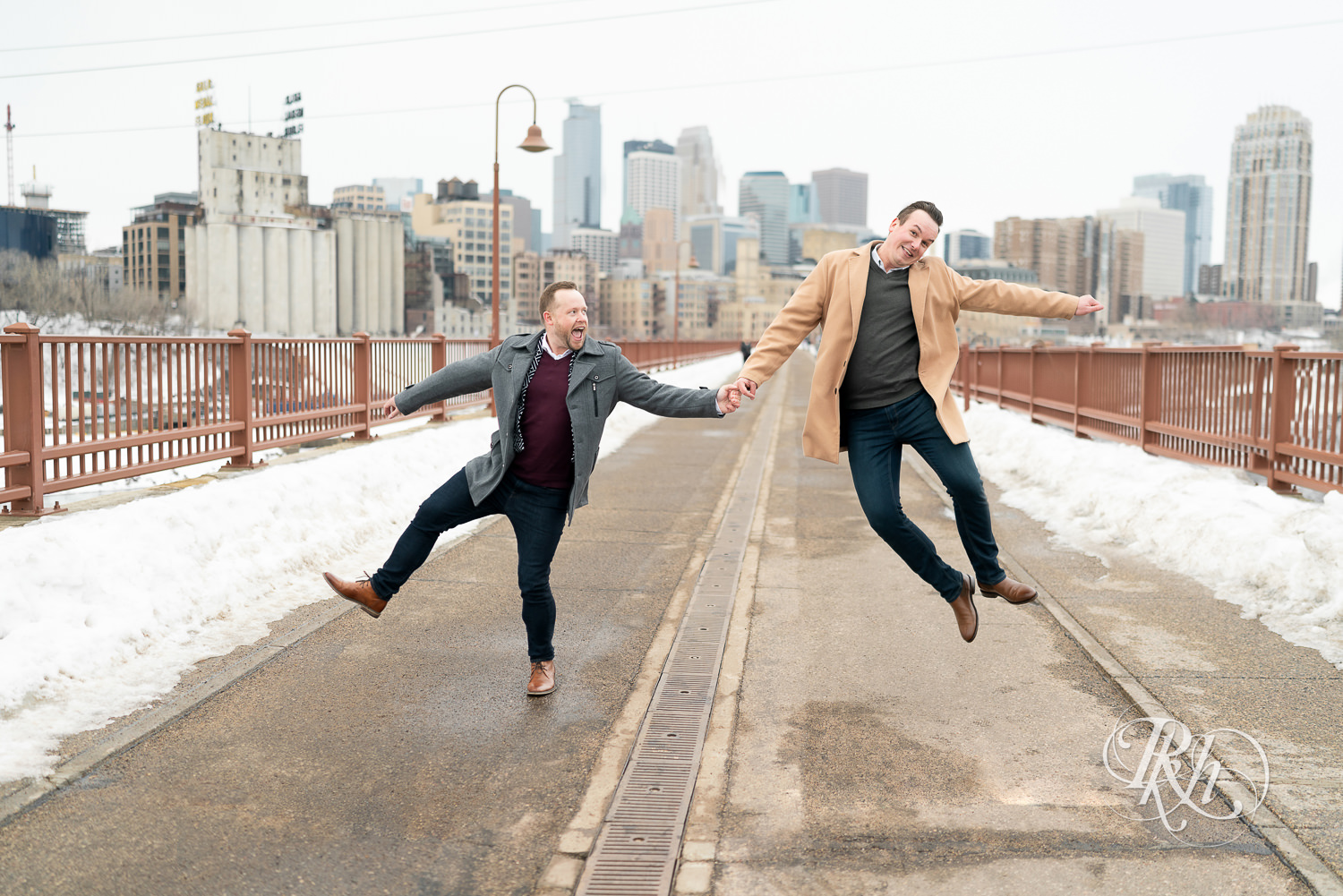 Gay men jump on the Stone Arch Bridge during the winter in Minneapolis, Minnesota.