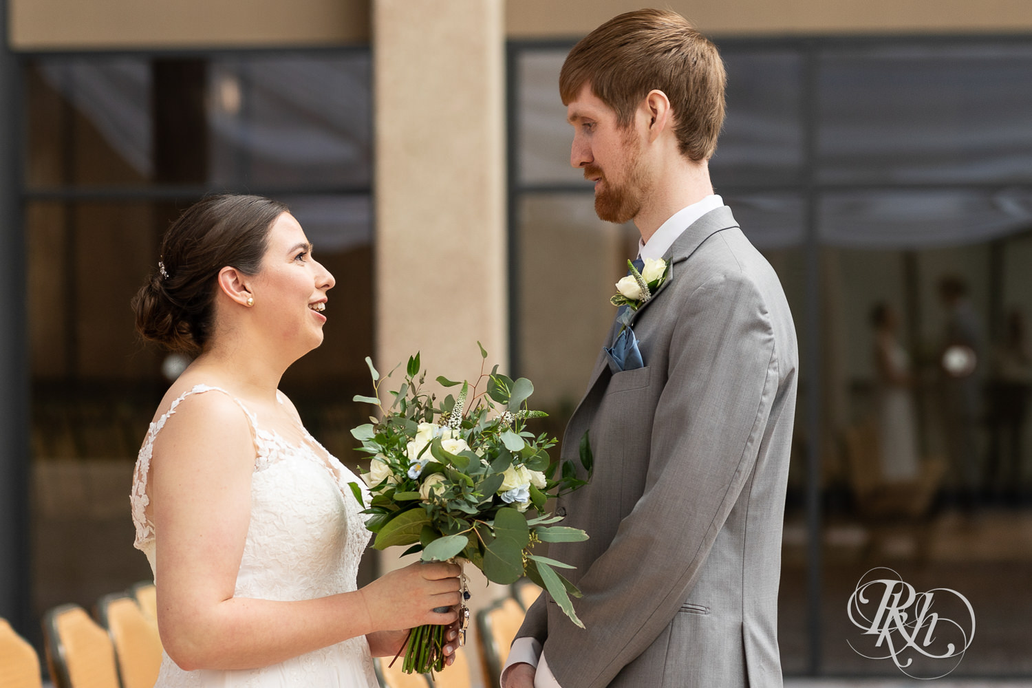 Bride and groom share first look at Doubletree Hilton Saint Paul in Saint Paul, Minnesota.