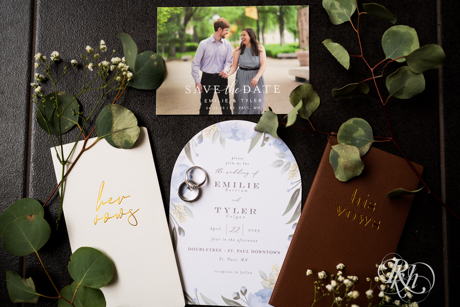 Wedding suite including rings, save the date, invitation, vow books and flowers. 