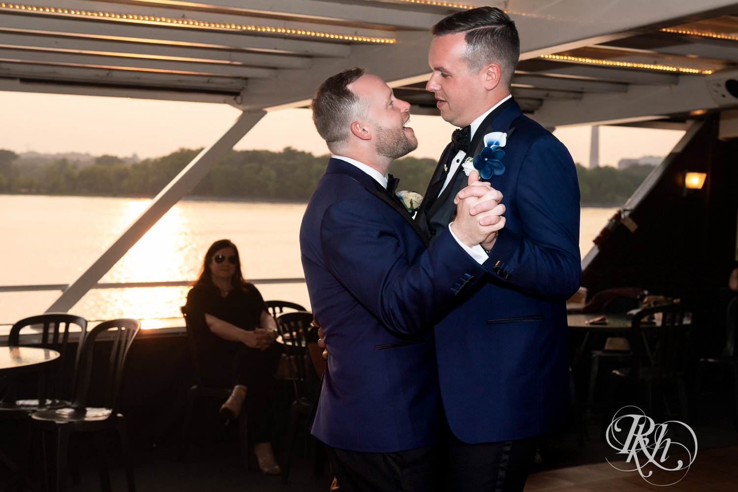 Grooms dance during wedding reception on the Majestic Star by Stillwater River Boats in Stillwater, Minnesota.