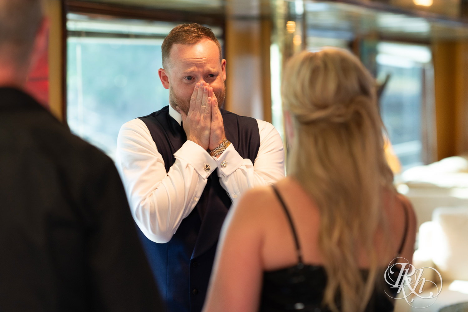 Grooms greet guests during receiving line on the Majestic Star by Stillwater River Boats in Stillwater, Minnesota.