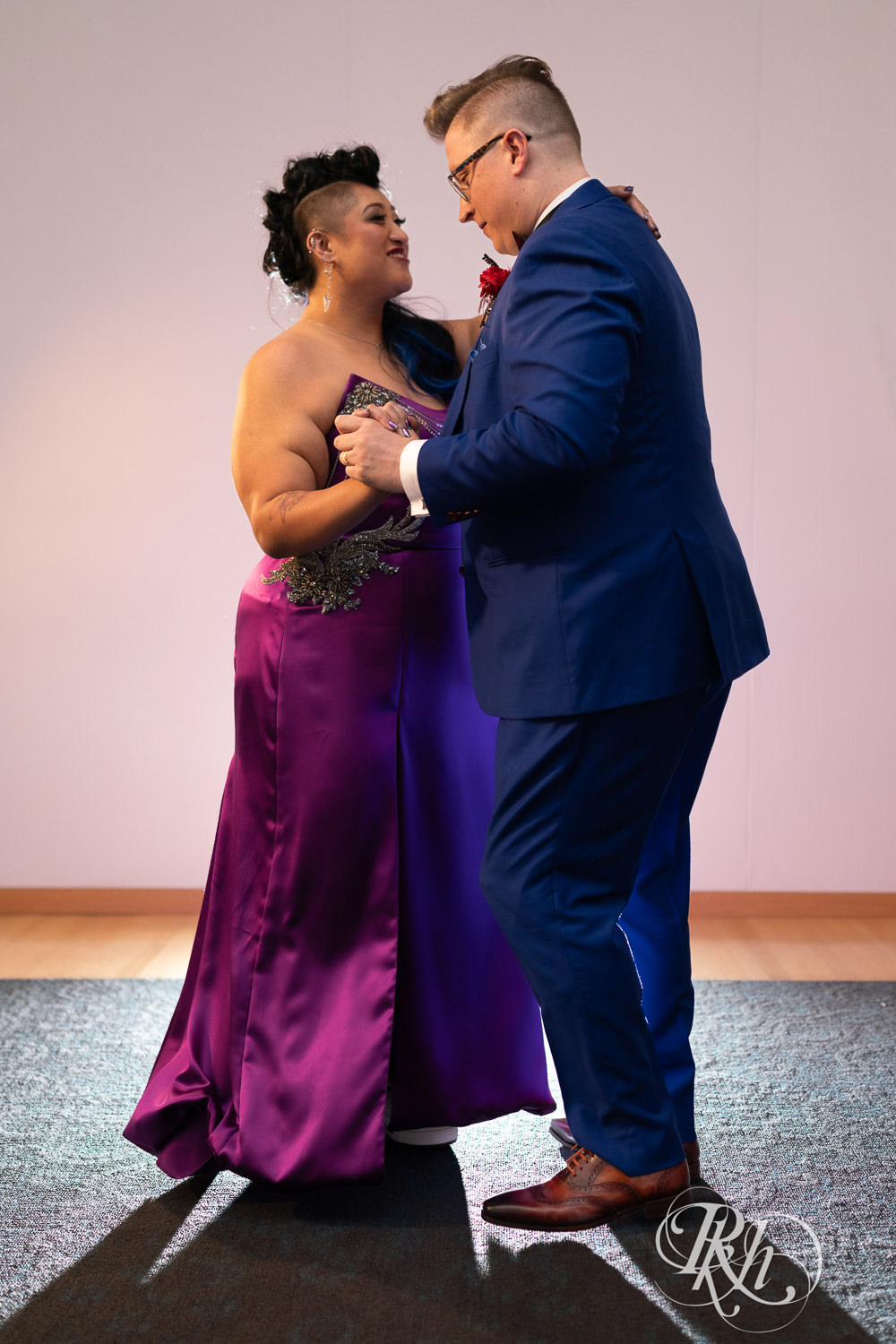 Filipino bride in purple wedding dress share first dance at the American Swedish Institute in Minneapolis, Minnesota.