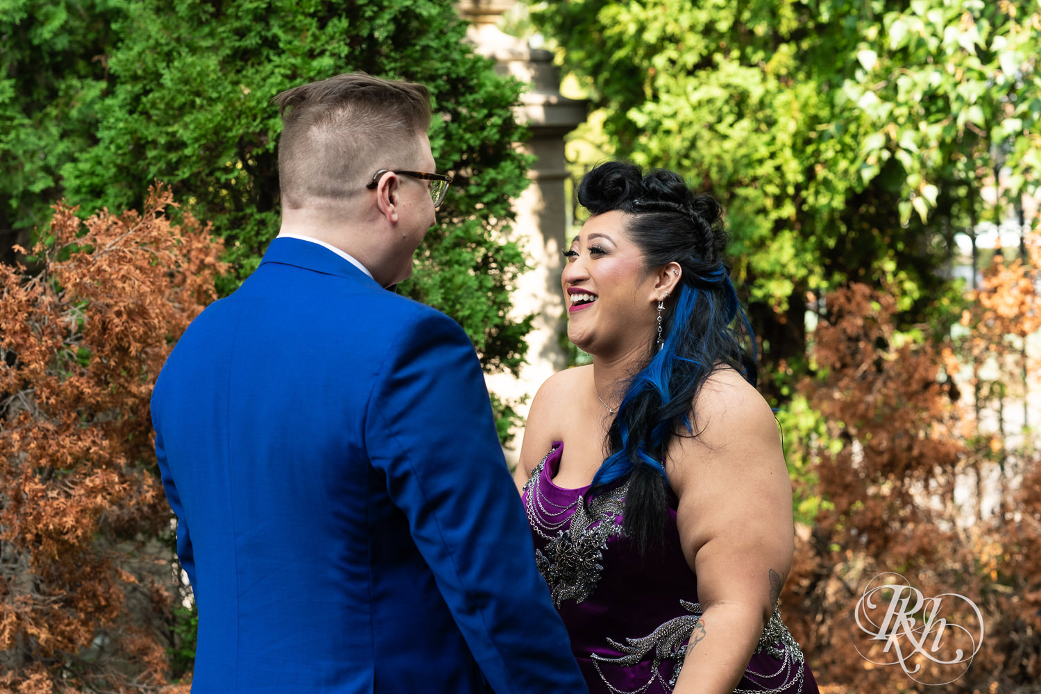 Filipino bride with mohawk dressed in purple wedding dress share first look with groom in Minneapolis, Minnesota.