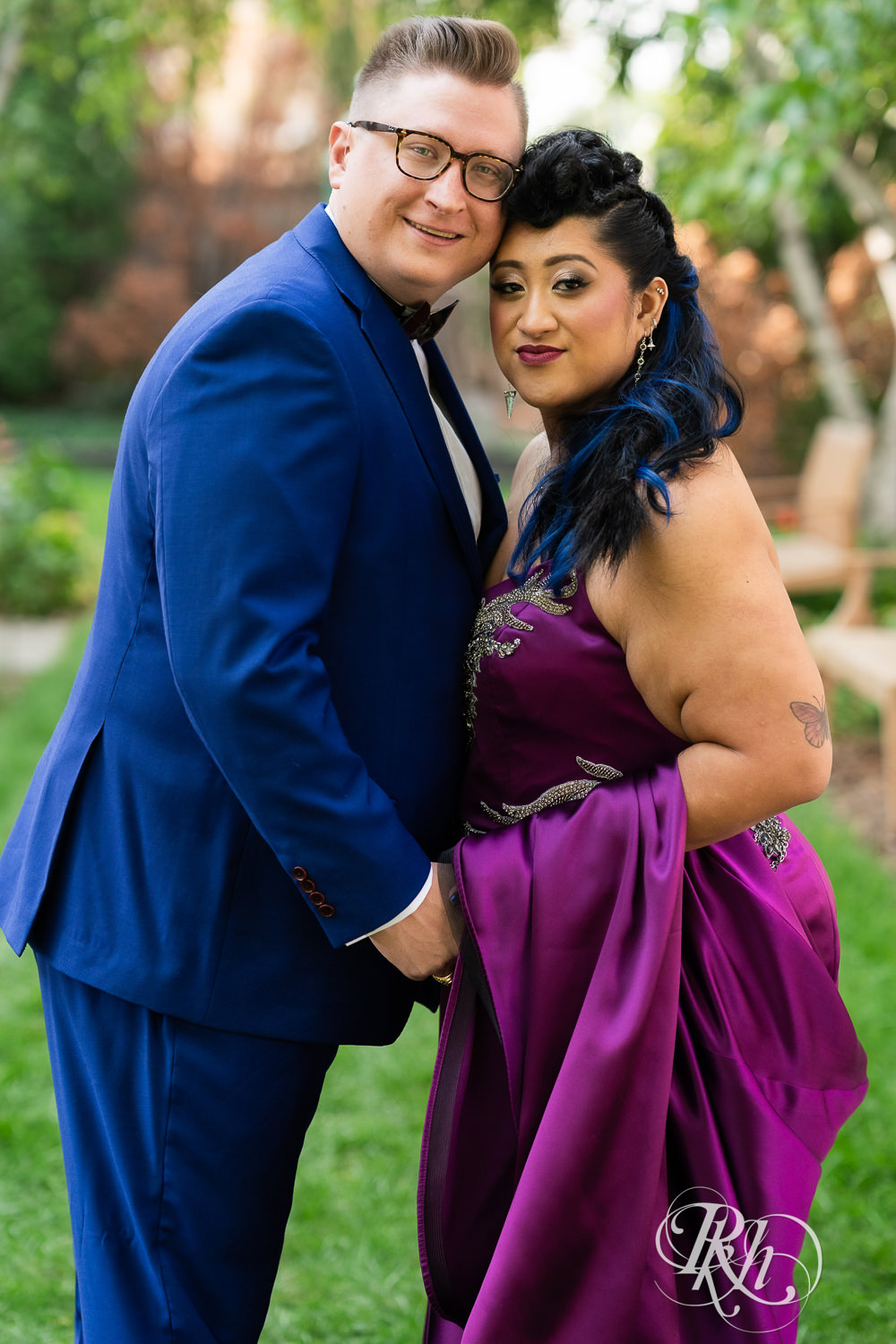 Filipino bride with mohawk dressed in purple wedding dress and groom smile at American Swedish Institute in Minnesota.