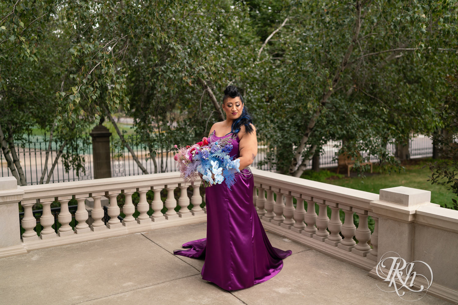 Filipino bride with mohawk dressed in purple wedding dress smiles at American Swedish Institute in Minnesota.