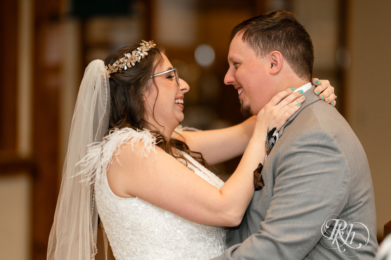 Bride and groom smile at Bunker Hills Event Center in Coon Rapids, Minnesota.