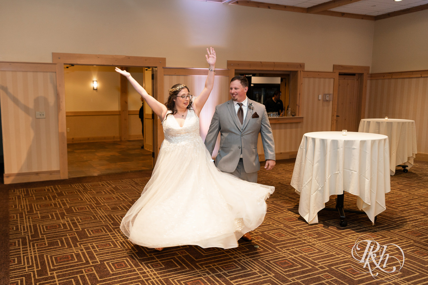 Bride and groom enter wedding reception at Bunker Hills Event Center in Coon Rapids, Minnesota.
