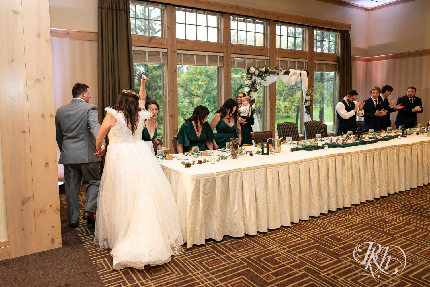 Bride and groom enter wedding reception at Bunker Hills Event Center in Coon Rapids, Minnesota.