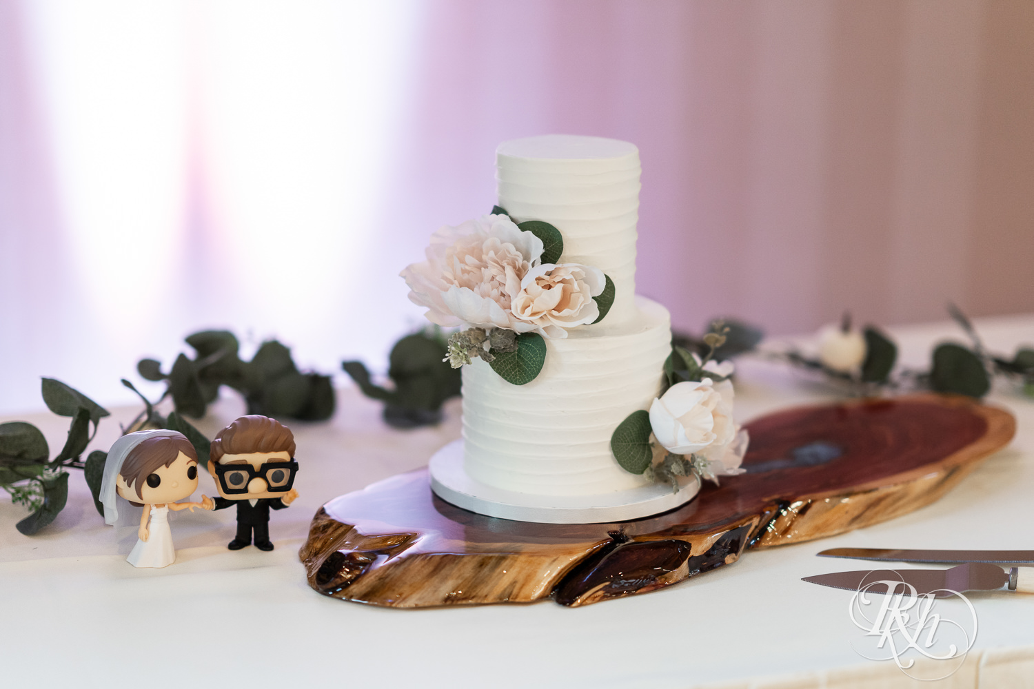 Wedding cake with Funko Pop topper at Bunker Hills Event Center in Coon Rapids, Minnesota.
