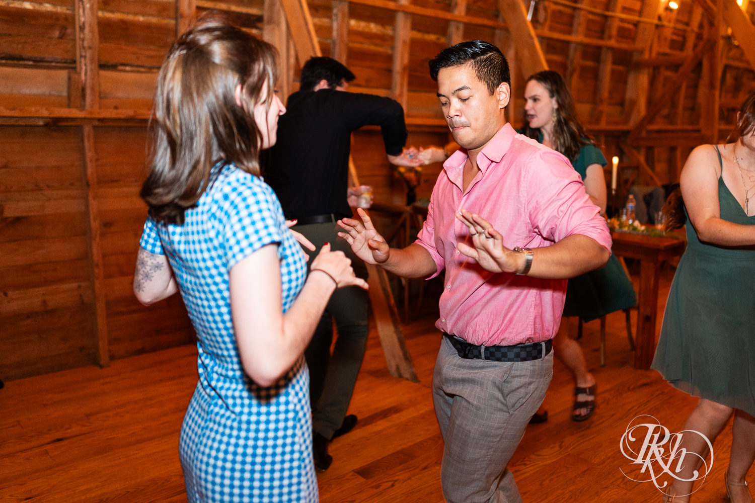 Guests dance during wedding recaption at Hayvn at Hay River in Boyceville, Wisconsin. 