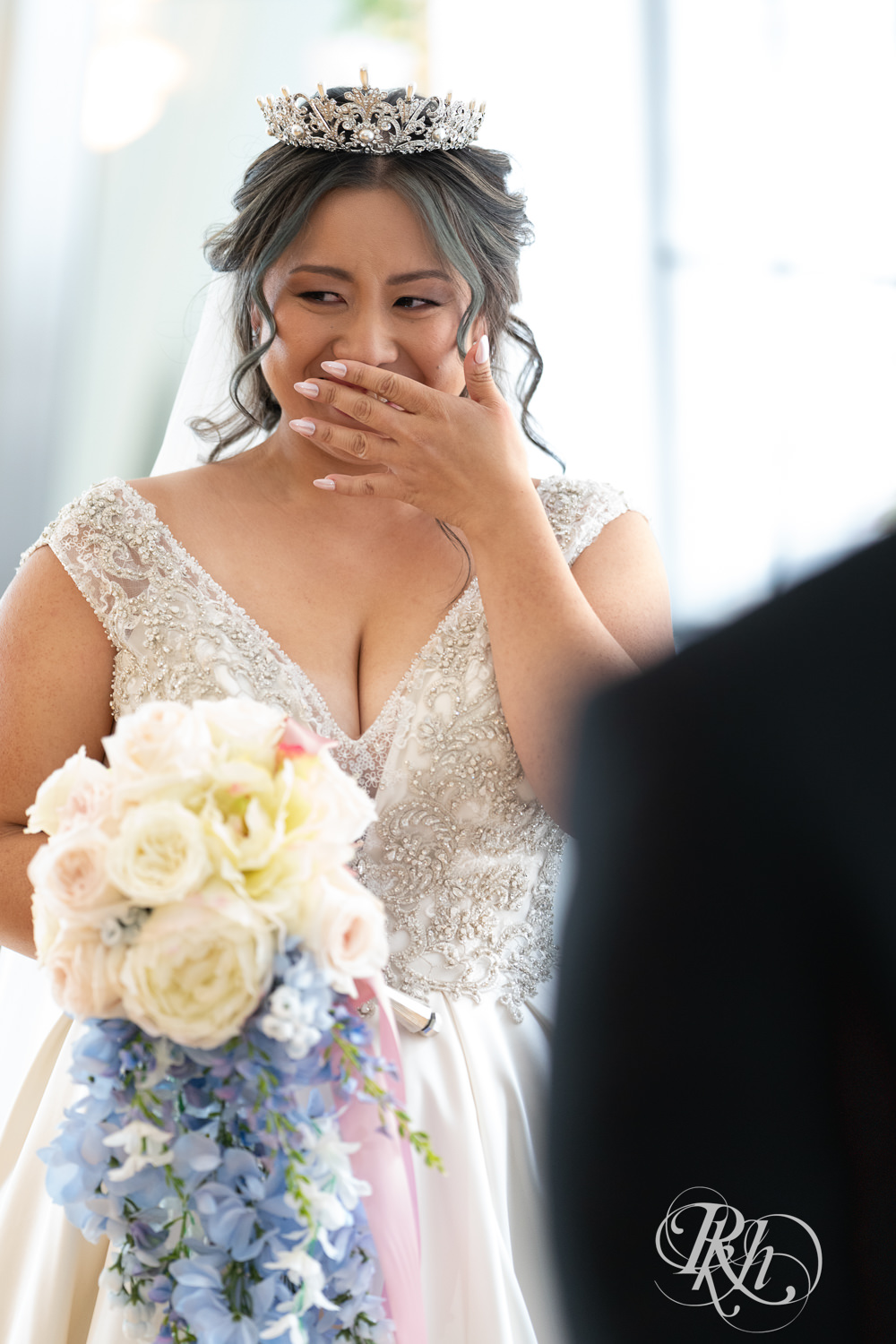 Hmong bride and groom share first look on wedding day at the Saint Paul Athletic Club in Saint Paul, Minnesota.