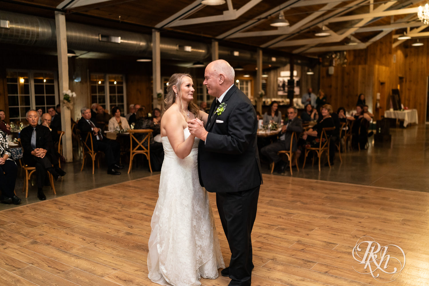 Bride and father dance at wedding reception at Almquist Farm in Hastings, Minnesota.