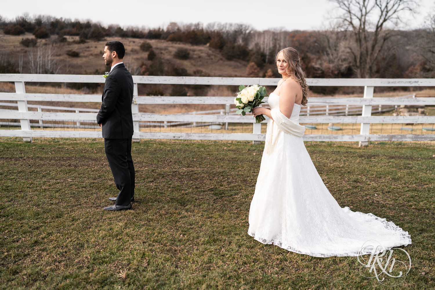 Bride and groom share first look on wedding day at Almquist Farm in Hastings, Minnesota.