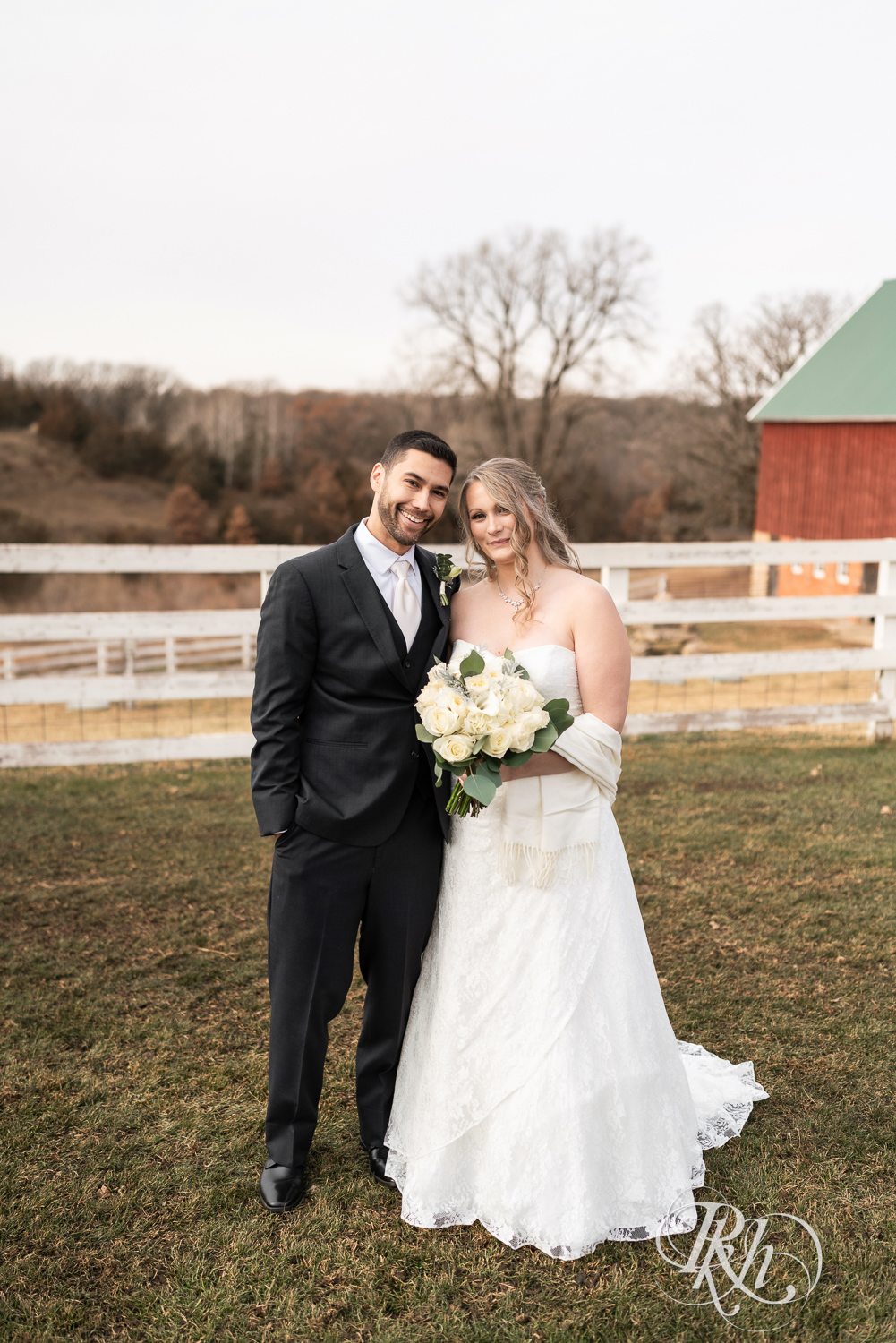 Bride and groom smile on wedding day at Almquist Farm in Hastings, Minnesota.