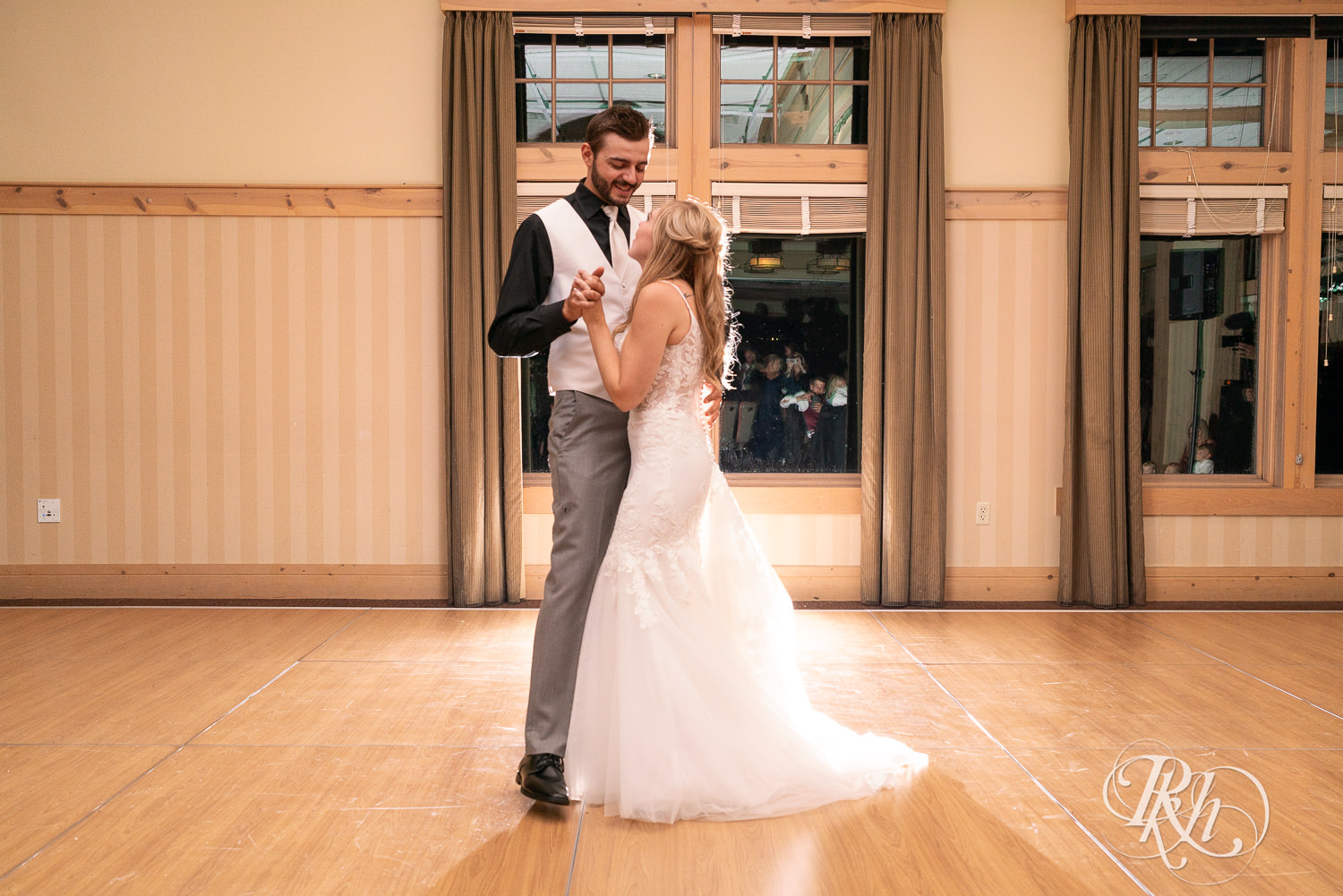 Bride and groom share first dance on wedding day at Bunker Hills Event Center in Coon Rapids, Minnesota.