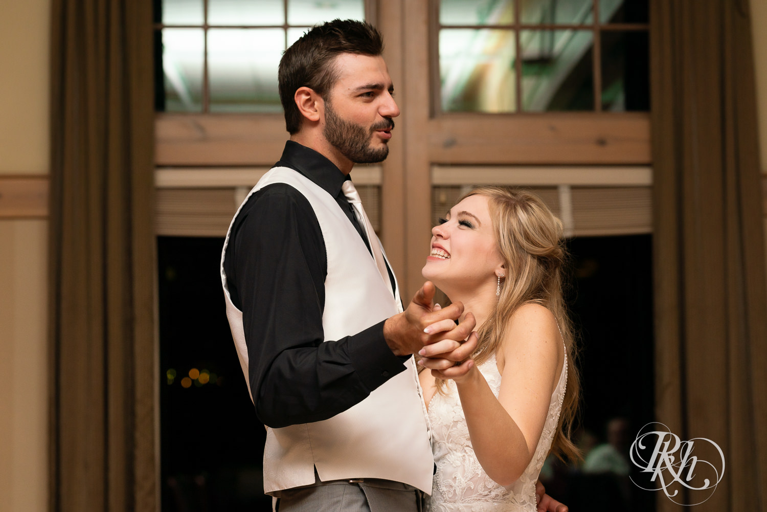 Bride and groom share first dance on wedding day at Bunker Hills Event Center in Coon Rapids, Minnesota.