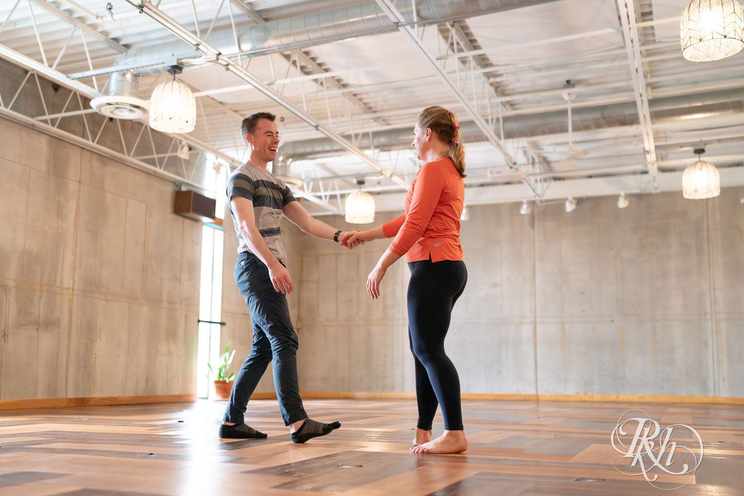 Man and woman dance in yoga studio at the Bouldering Project in Minneapolis, Minnesota.