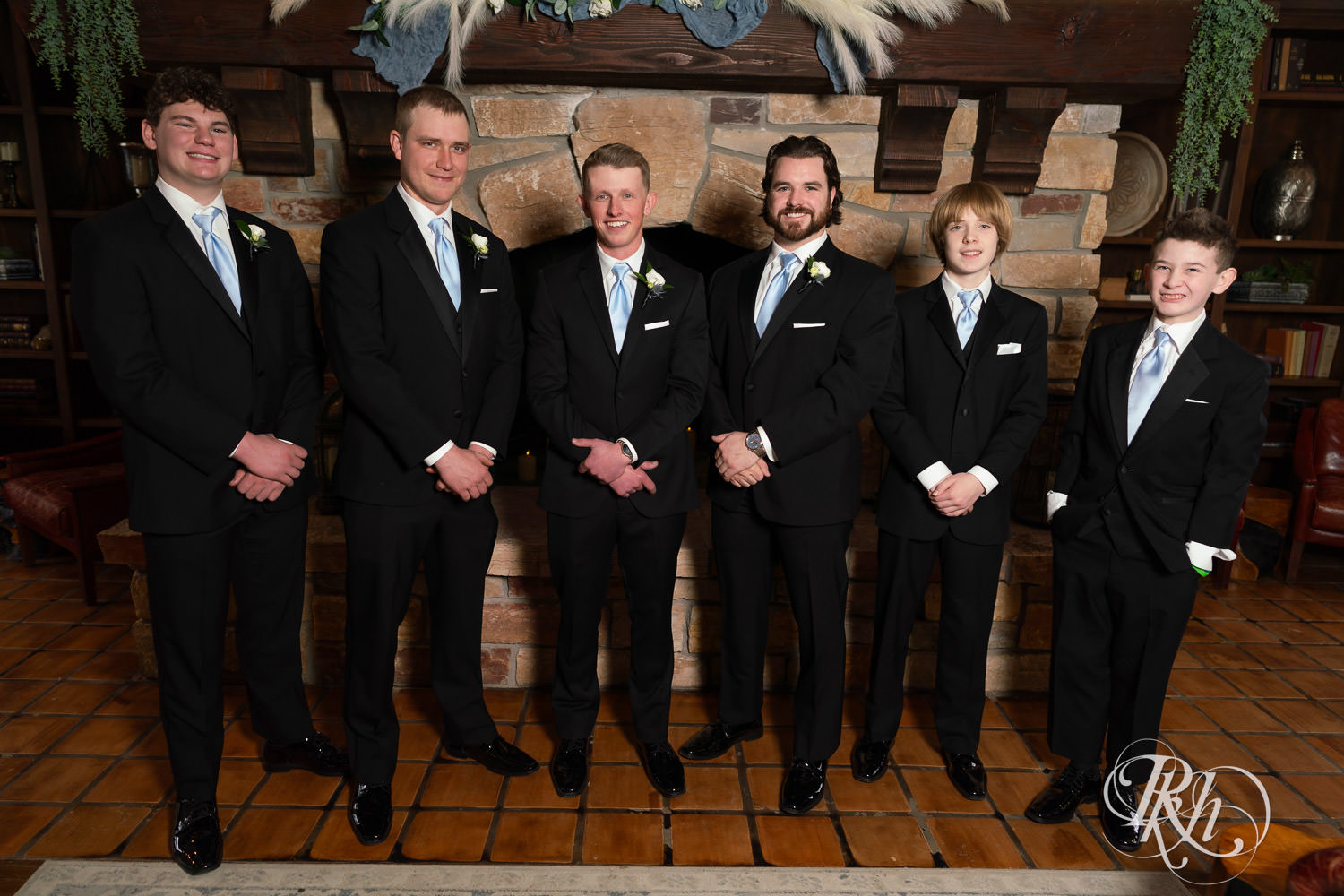 Wedding party smiles with the groom during wedding photography at Bavaria Downs in Chaska, Minnesota.