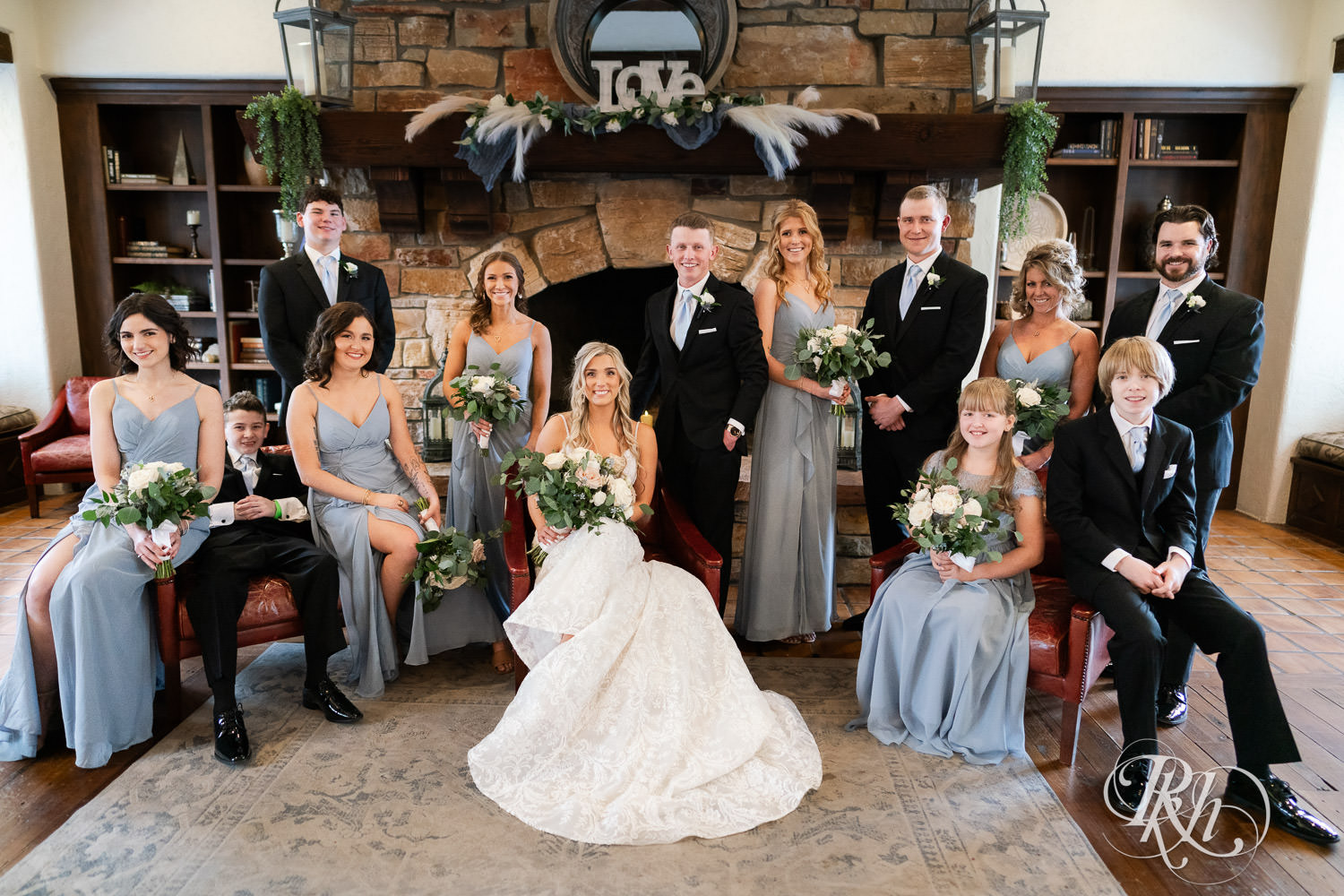 Wedding party smiles with the bride and groom during wedding photography at Bavaria Downs in Chaska, Minnesota.