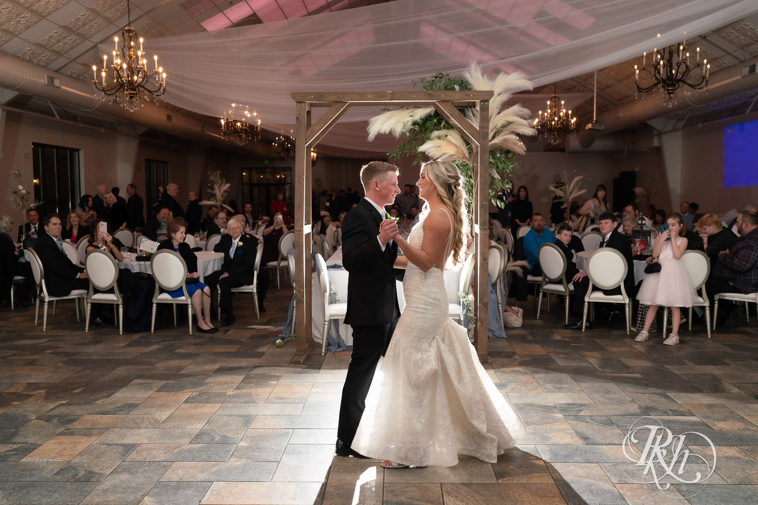 Bride and groom share first dance at wedding reception at Bavaria Downs in Chaska, Minnesota.