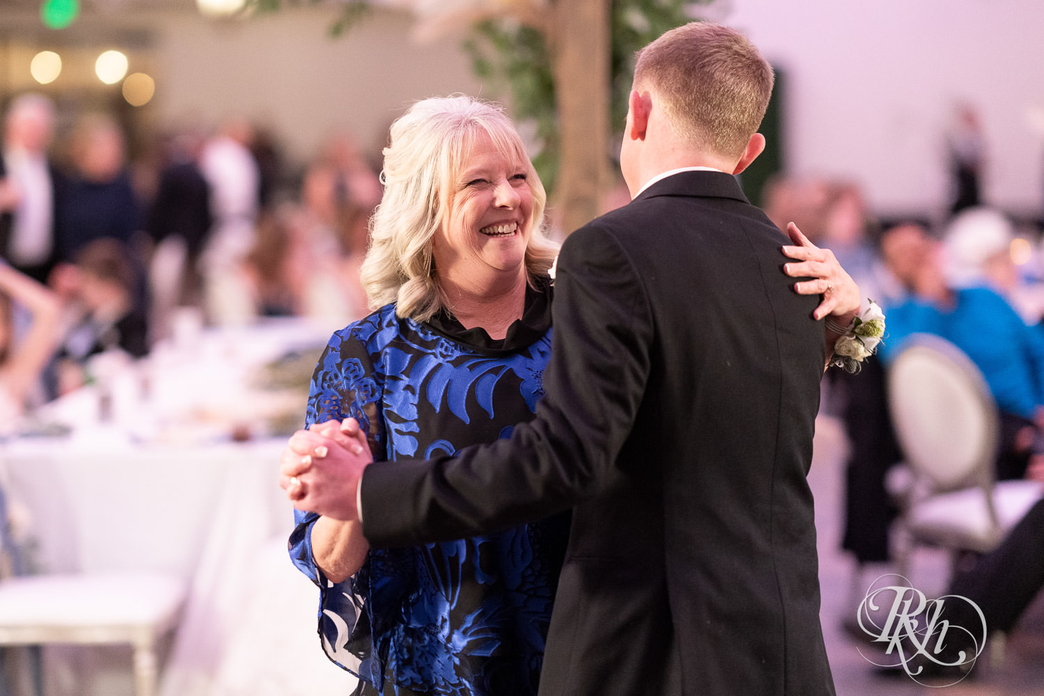 Groom and his mother dance at wedding reception at Bavaria Downs in Chaska, Minnesota.
