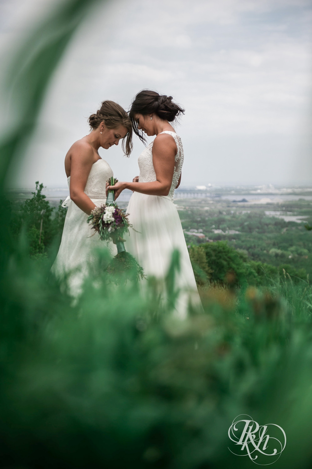 Lesbian brides kiss outside at Spirit Mountain in Duluth, Minnesota.