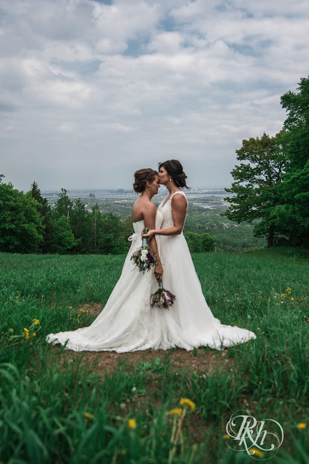 Lesbian brides kiss outside at Spirit Mountain in Duluth, Minnesota.