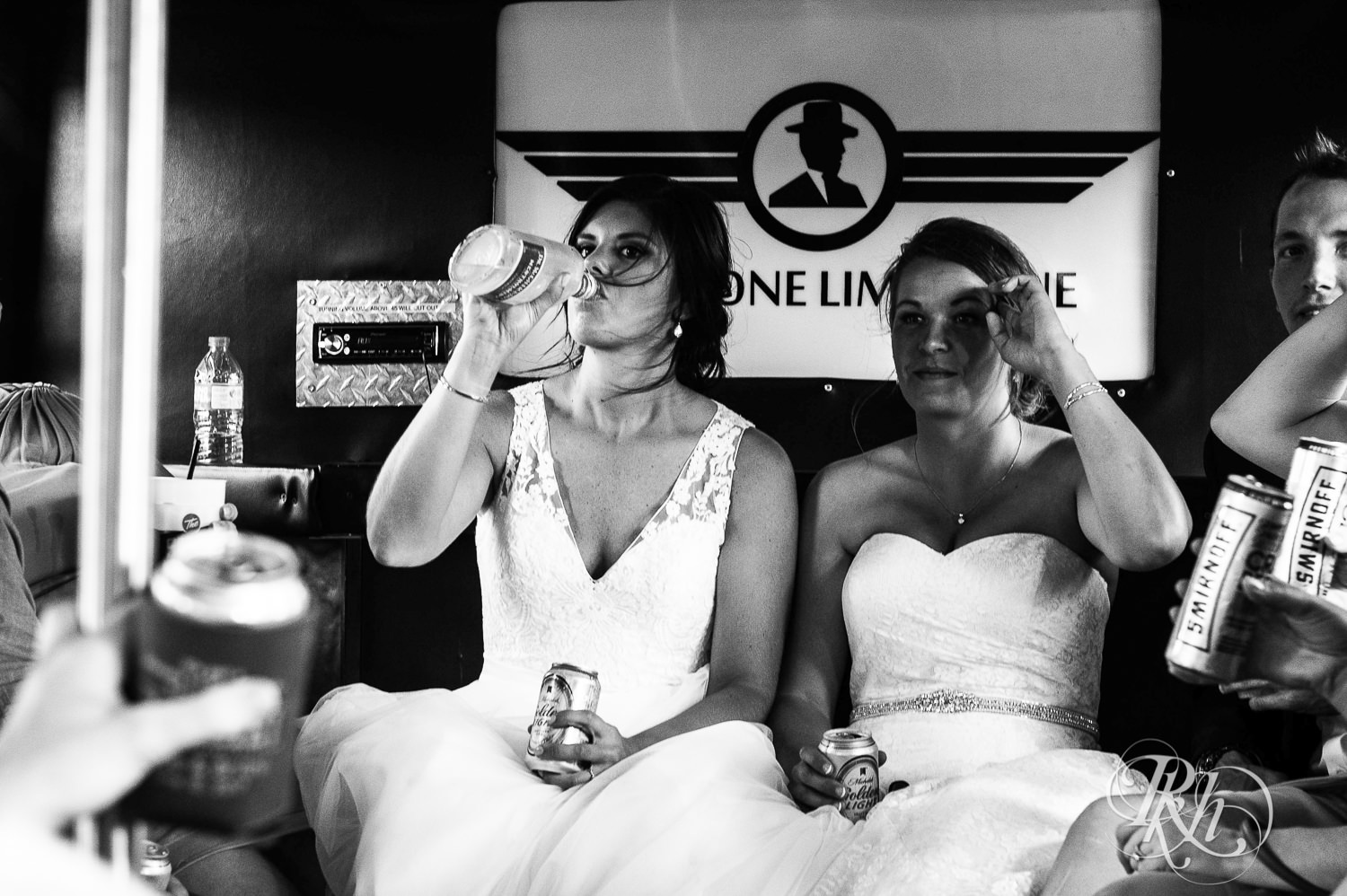 Lesbian brides drink on a party bus in Duluth, Minnesota.