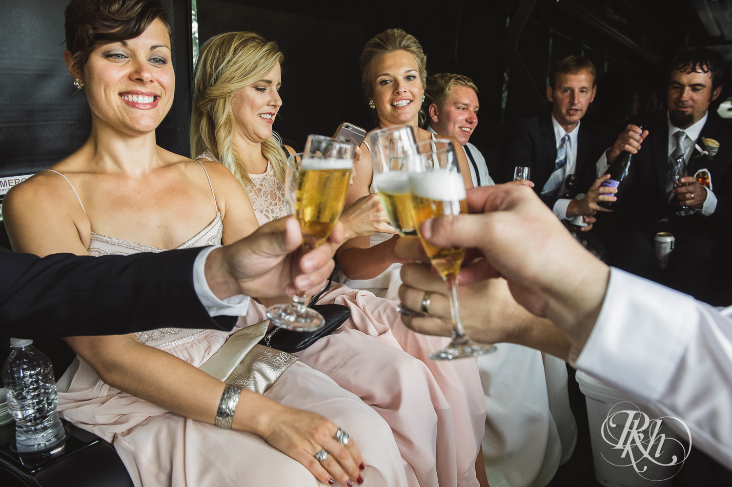 Wedding party drinks on party bus in Minneapolis, Minnesota.