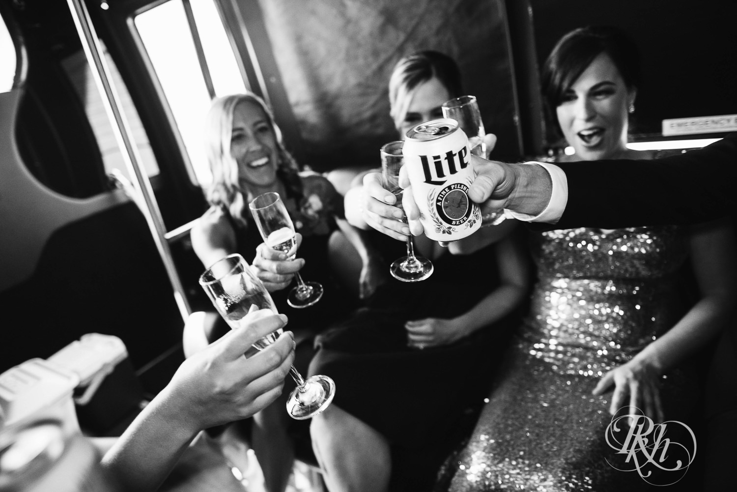 Wedding party drinks on party bus in Minneapolis, Minnesota.