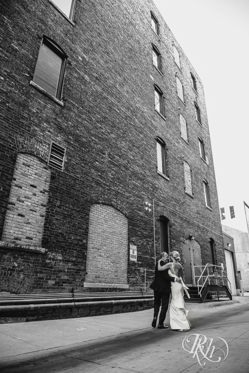 Bride and groom dance in an alley on their wedding day in Minneapolis, Minnesota.