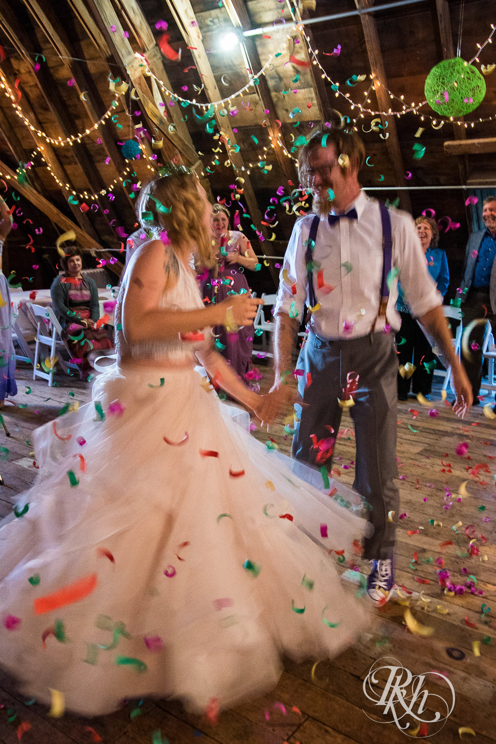 Bride and groom dance during wedding reception at Coops Event Barn in Dodge Center, Minnesota.