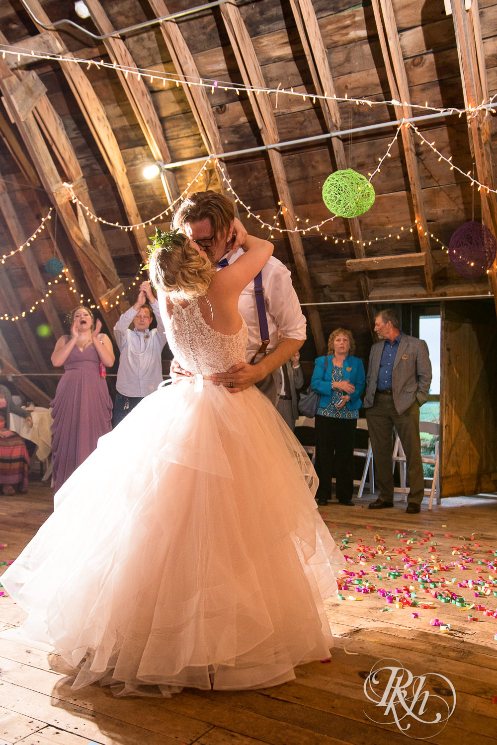 Bride and groom dance during wedding reception at Coops Event Barn in Dodge Center, Minnesota.