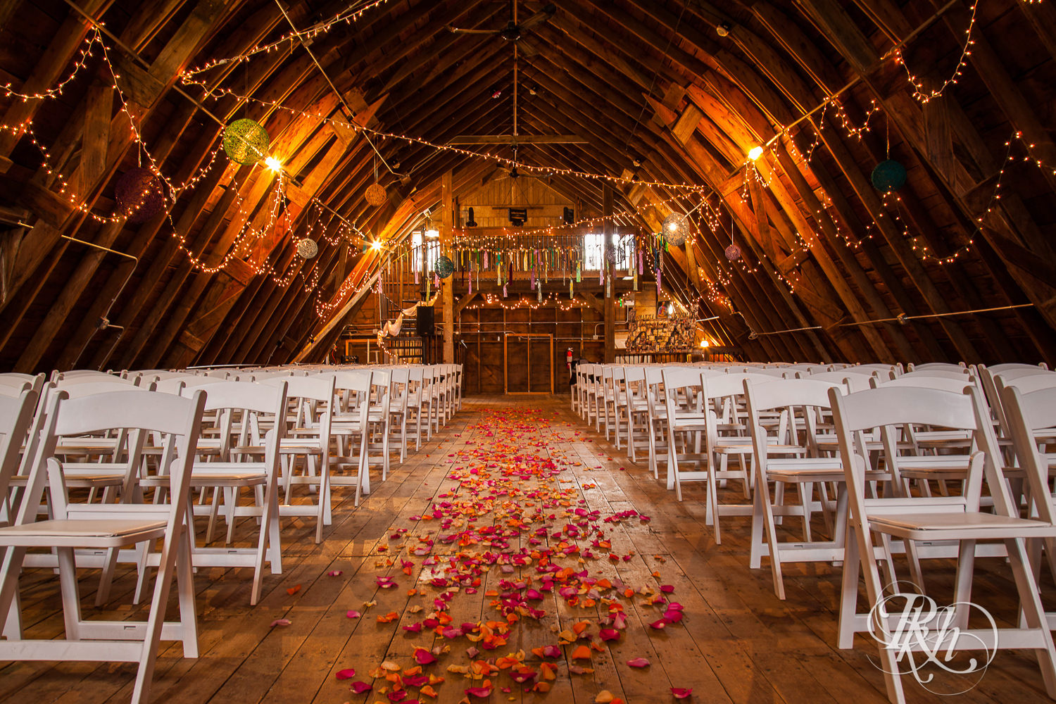 Indoor barn wedding ceremony space at Coops Event Barn in Dodge Center, Minnesota.