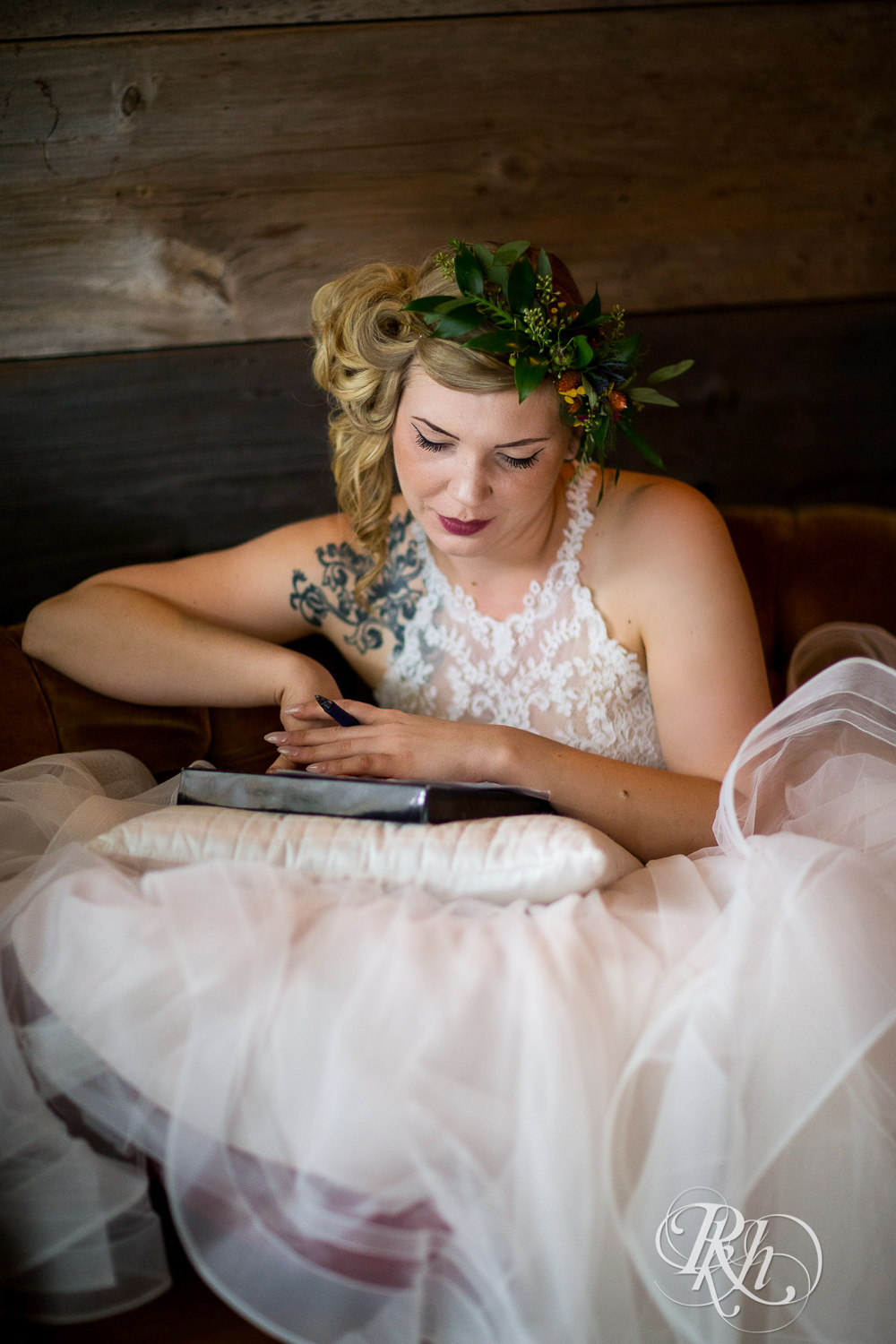 Bride writes vows before wedding at Coops Event Barn in Dodge Center, Minnesota.