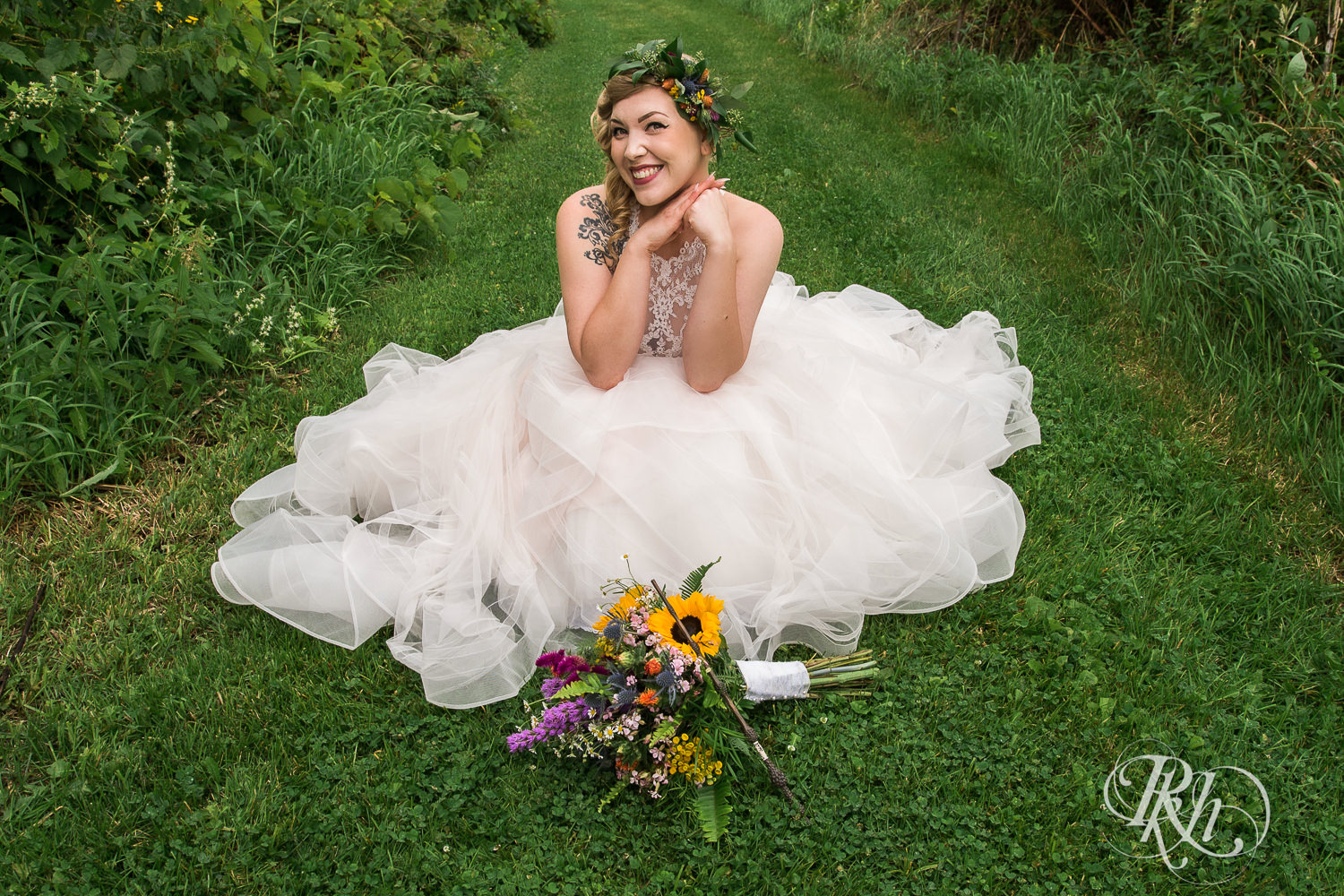 Bride smiles before wedding at Coops Event Barn in Dodge Center, Minnesota.