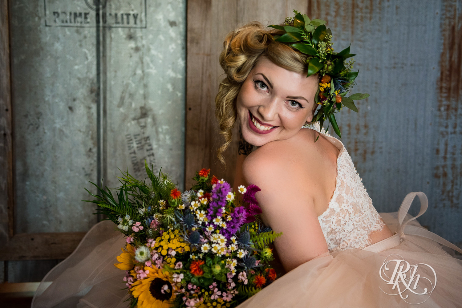 Bride smiles before wedding at Coops Event Barn in Dodge Center, Minnesota.